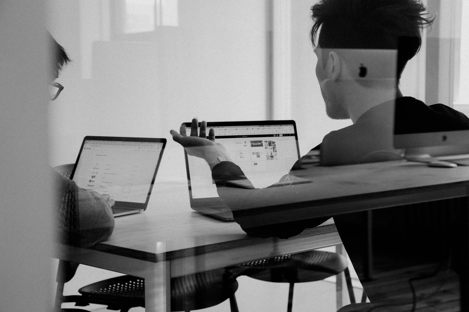 Person working on digital materials with laptop